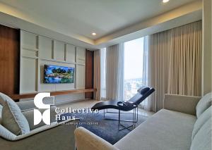 a living room with a couch and a table at Tropicana Residence Kuala Lumpur by Collective Haus in Kuala Lumpur +30 photos