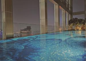 a large swimming pool on the top of a building at Tropicana Residences Kuala Lumpur by Collective Haus in Kuala Lumpur