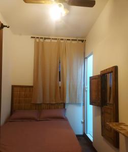 Un ou plusieurs lits dans un hébergement de l'établissement Pousada Seu Souza