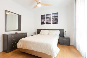 En eller flere senge i et værelse på Dormir en el Palo Beach Pets Friend