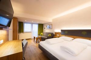 Ein Bett oder Betten in einem Zimmer der Unterkunft Hotel Bergkranz