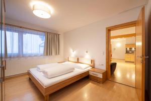 Ein Bett oder Betten in einem Zimmer der Unterkunft Hotel Bergkranz