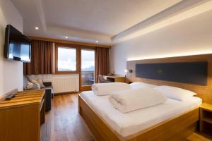 Ein Bett oder Betten in einem Zimmer der Unterkunft Hotel Bergkranz