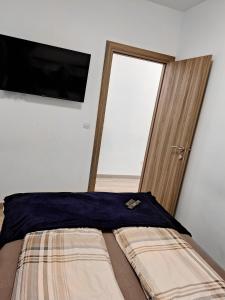 Posteľ alebo postele v izbe v ubytovaní APARTMENT NEVERA