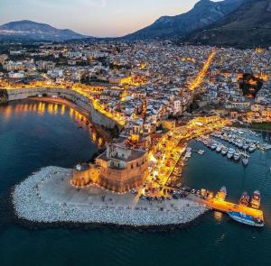 an aerial view of a city at night at Domus Federiciana in Castellammare del Golfo