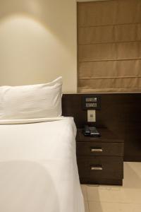 Katil atau katil-katil dalam bilik di Freesia Residency by Express Inn