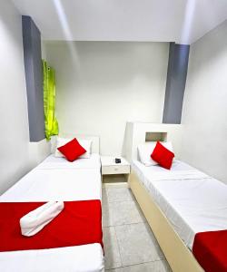 Postel nebo postele na pokoji v ubytování JRJA Suites 1 near Card Bank Tagum