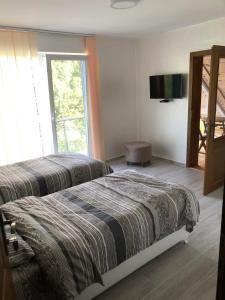 Uma cama ou camas num quarto em Vila Djekic