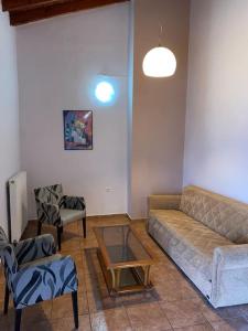 a living room with a couch and two chairs at Μεζονέτα AIKATERINI N 9 in Chios +22 photos