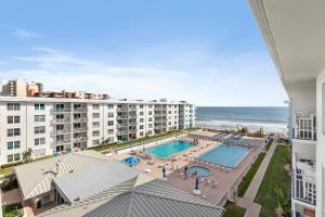 Sea Coast Gardens III 513 في نيو سميرنا بيتش: منظر جوي لمنتجع به حمام سباحة والمحيط