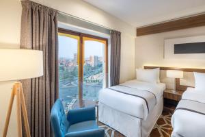 Postel nebo postele na pokoji v ubytování Blue Coral Hotel + 34 fotografií
