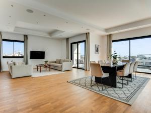 a living room with a table and chairs at Sanders Crystal 1 in Limassol