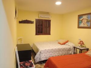 a bedroom with two beds and a window at Lo de franco in Salta