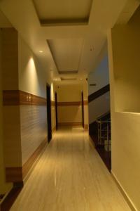 a hallway with a bowling alley in a building at The Divine Oak Golden Leaf , Katra in Katra