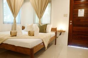 Voodi või voodid majutusasutuse General's Hideout Siargao toas
