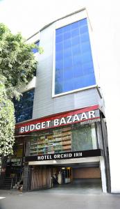 a building with a bulbert bakeryadobe at Hotel Orchid INN at Budget Bazaar Janakpuri in New Delhi