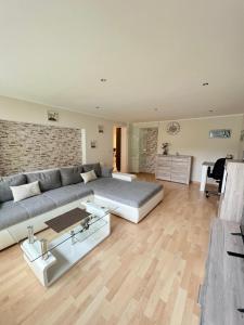 a large living room with a bed and a couch at Elpe in Olsberg