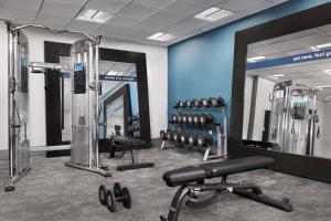 a fitness room with a gym with weights and a mirror at Hampton Inn & Suites El Paso/East in El Paso