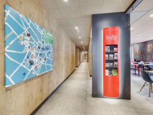 a coca cola vending machine in a hallway at ibis Saint Germain en Laye Centre in Saint-Germain-en-Laye