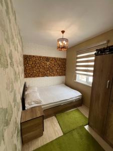 Cama ou camas em um quarto em Qimiz.Uz
