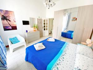 Postel nebo postele na pokoji v ubytování Aria di Mare Mancaversa - Elegante Appartamento