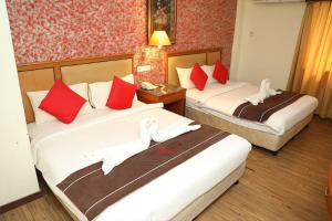 Ліжко або ліжка в номері Hotel Wings Kuala Lumpur