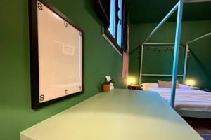 Posteľ alebo postele v izbe v ubytovaní HOMESTAY rooftop