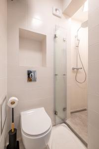 a bathroom with a toilet and a shower at Town Place - 1 Bedroom Apartment in Sofia