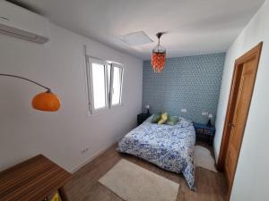 Postelja oz. postelje v sobi nastanitve Stylish apartments near the beach, Chilches Coast