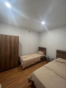 a room with two beds in a room with at Pushkiin in Yerevan