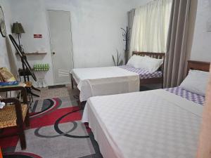 Postel nebo postele na pokoji v ubytování D & N LODGE