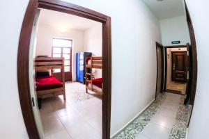a mirror in a room with a bedroom at MARHABA INN by HB Hostels in Tétouan