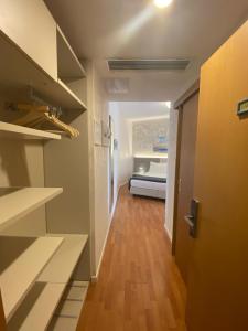 Ένα ή περισσότερα κρεβάτια σε δωμάτιο στο Hotel Angelini