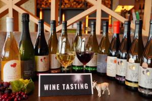 a bunch of bottles of wine sitting on a table at Winery Hotel and Condominium HITOHANA in Furano