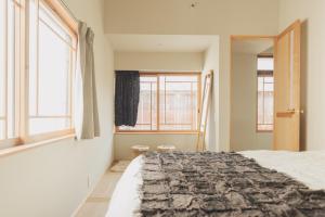 Postel nebo postele na pokoji v ubytování Une stay&diner