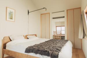 Postel nebo postele na pokoji v ubytování Une stay&diner