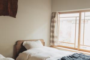 Postel nebo postele na pokoji v ubytování Une stay&diner