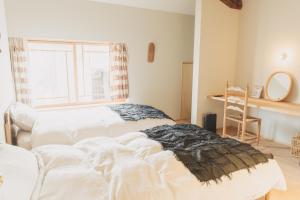 Postel nebo postele na pokoji v ubytování Une stay&diner
