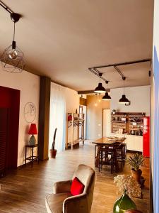 a living room with a couch and a table at Carrales Guest House in Nuoro