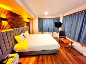Katil atau katil-katil dalam bilik di Naila Hotel