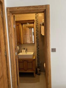 a bathroom with a sink and a mirror at Veziroğlu Apart in Datca