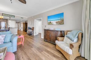 a living room with a couch and a table at Grandview East 702 in Panama City Beach