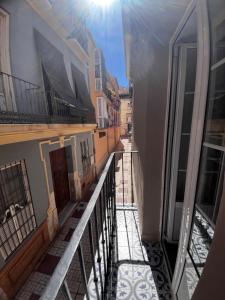 a view of a balcony of a building at Shanti’s Andalusian Rooms in Málaga