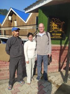 a group of three people standing in front of a building at Da Shack in Mandi