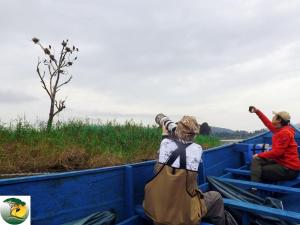 a couple of people in a blue truck at Antique cottages in Kabale