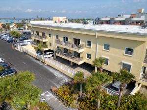 an aerial view of a building with a parking lot at 239 Surf Song Resort in St. Pete Beach