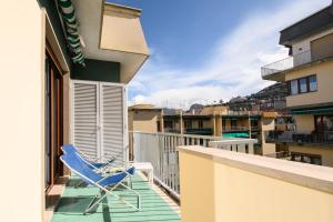 a blue chair sitting on the balcony of a building at Casa Maflogi in Sorrento