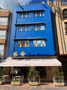 a blue building with the hotel peetter at Hotel Tio Pepe in Peniscola