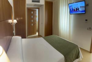 Postel nebo postele na pokoji v ubytování Hotel Tio Pepe
