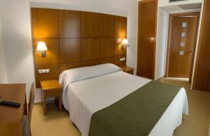 Postel nebo postele na pokoji v ubytování Hotel Tio Pepe